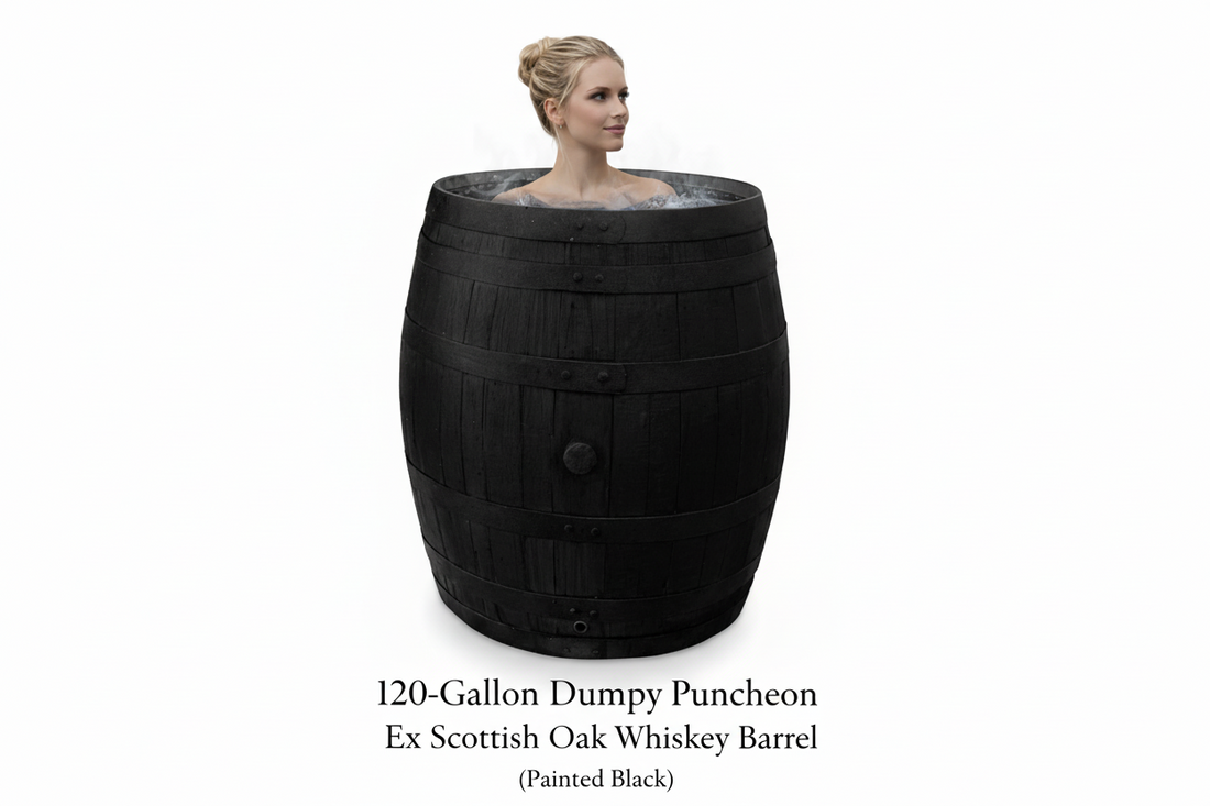 
                      
                        Person in a large black oak barrel ice bath for cold water therapy and cold water plunge
                      
                    